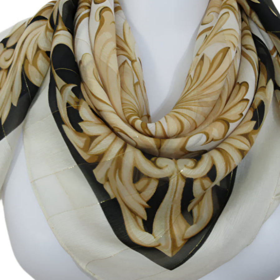 Echo Decorative scarf with intricate patterns on a mannequin against a white background