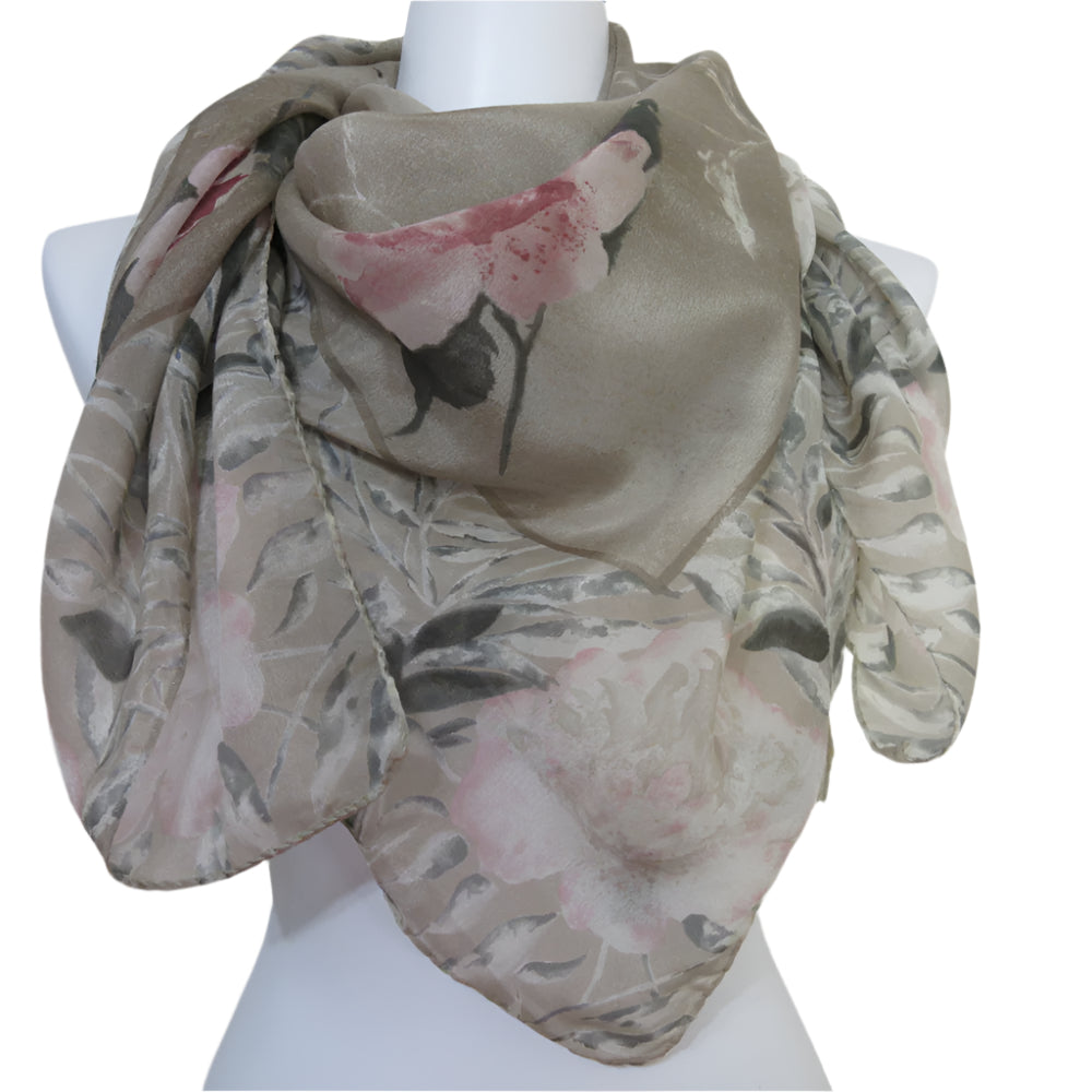 Saldarini floral patterned scarf on a mannequin against a plain background