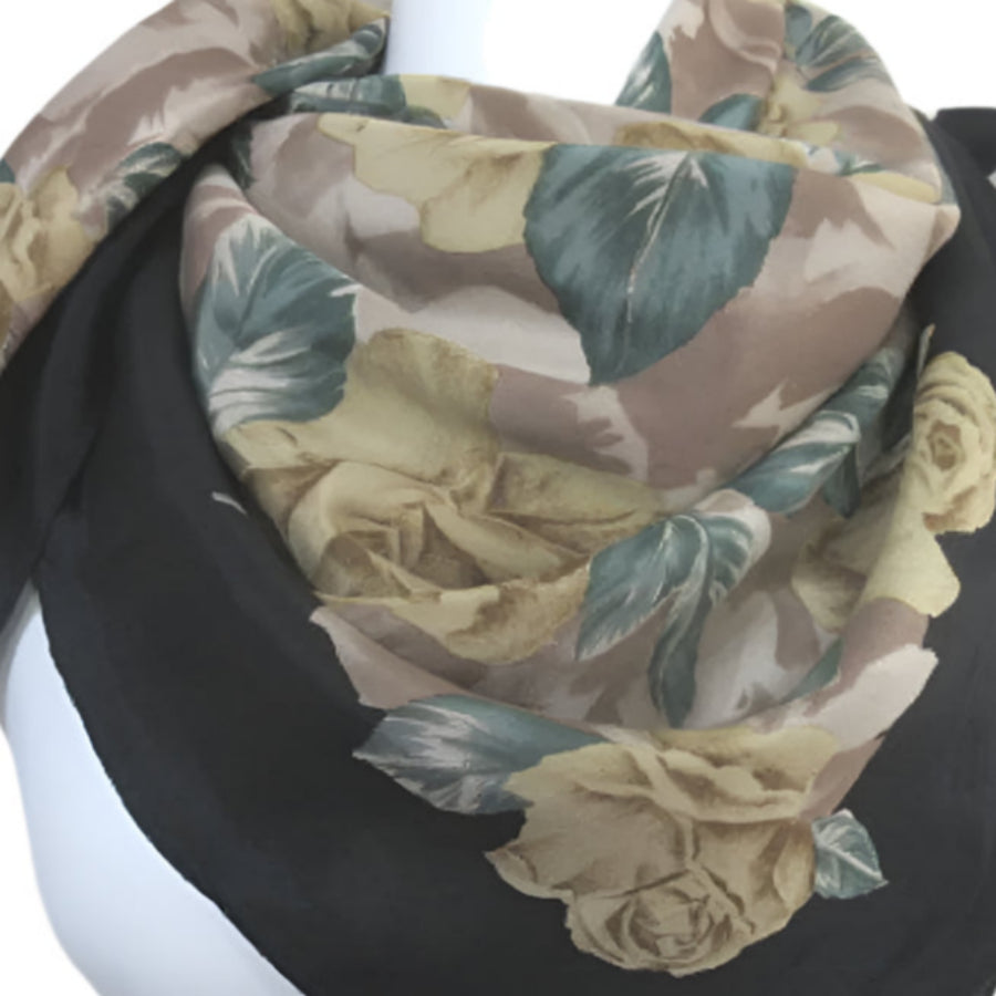 Hiroko Floral patterned scarf on a mannequin against a plain background