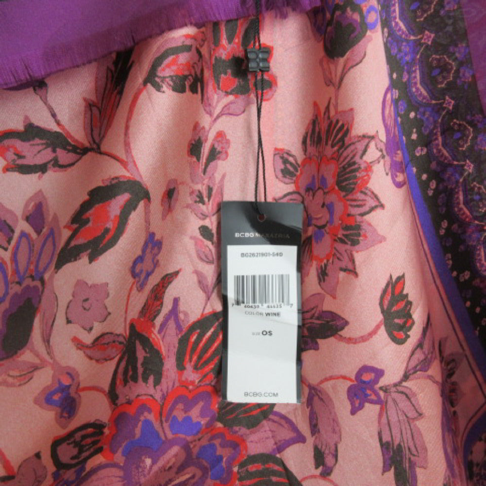 Floral-patterned garment with a tag on a pink background
