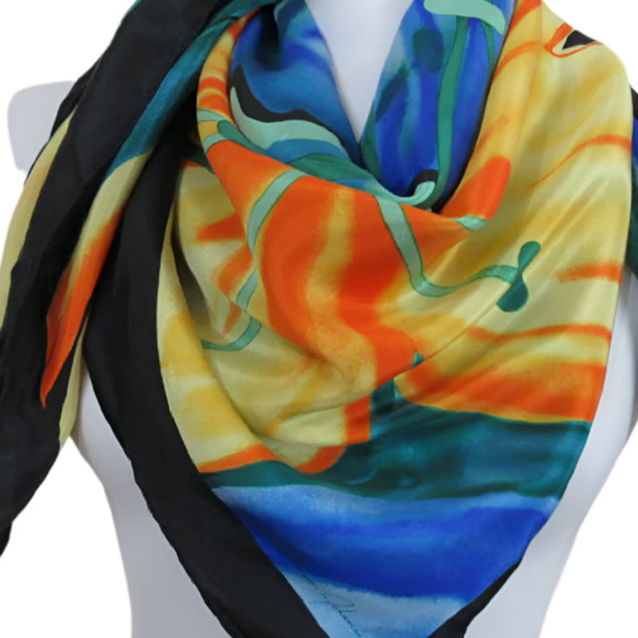 Ginnie Johansen Colorful scarf with abstract design on a mannequin against a white background