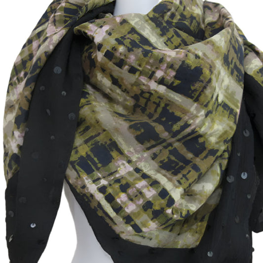 Vera Wang black and green patterned scarf draped over it against a white background