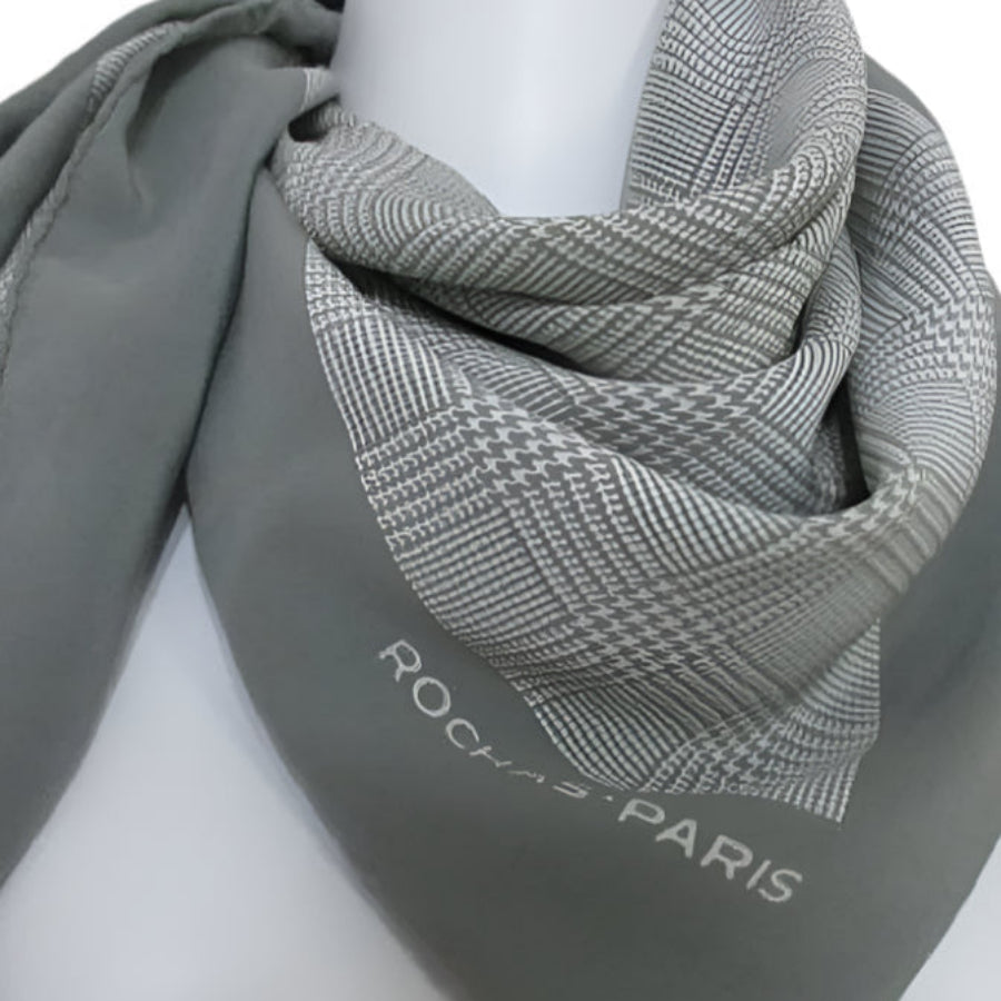Rochas Paris Gray scarf with patterned edge on a mannequin against a white background