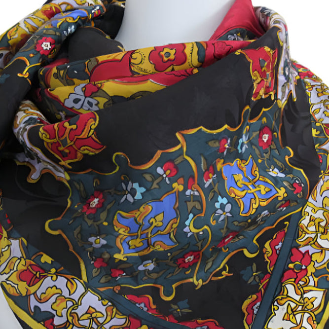 Colorful patterned scarf on a mannequin with 'Nicole de Beauvoir' branding.