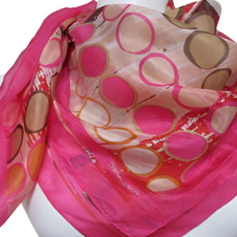 Cynthia Rowley Pink Colorful patterned scarf on a mannequin against a white background
