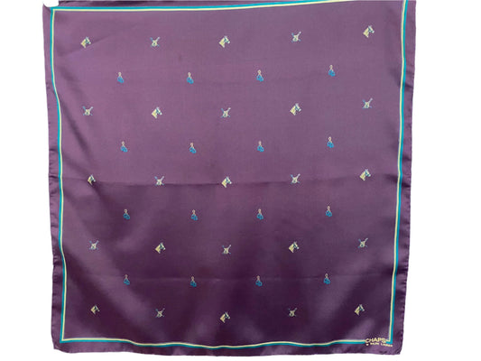 Purple Ralph Lauren scarf with small geometric patterns on a light blue background