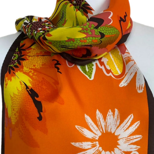 Colorful floral Adrienne Landau scarf on a mannequin with a plain background