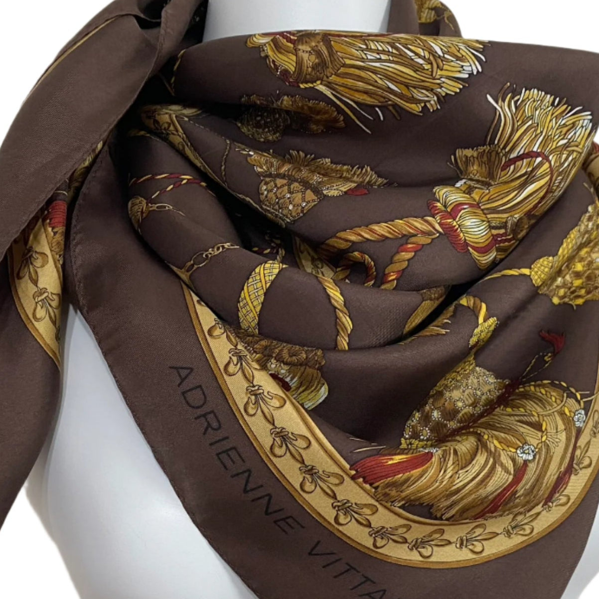 Adrienne Vittadini Brown scarf with gold and red floral patterns on a mannequin