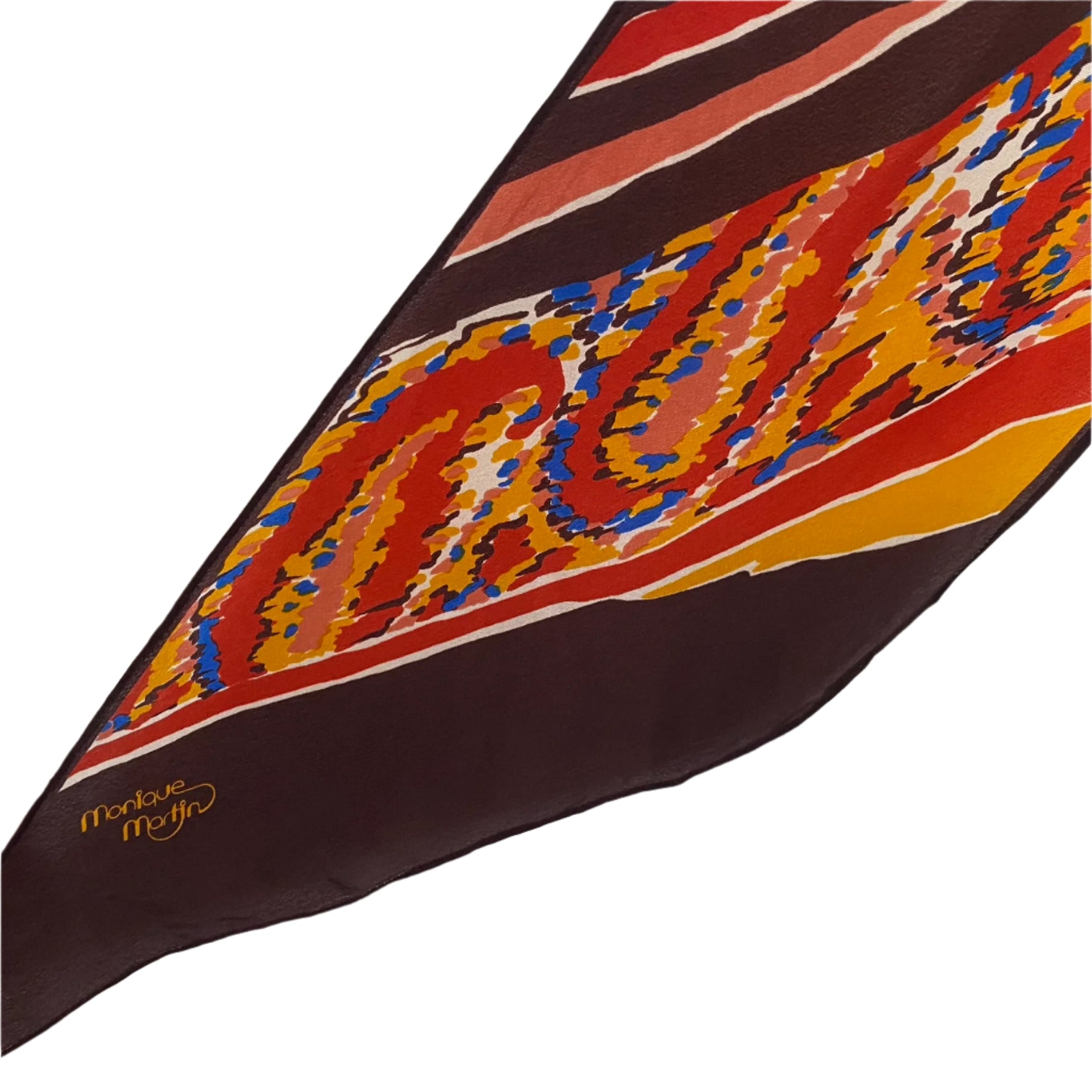 Monique Martin Colorful patterned fabric with a brand logo on a white background