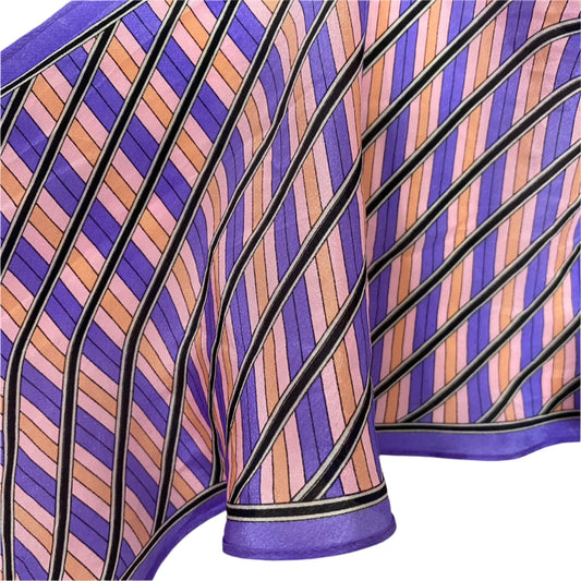 Close-up of a purple and brown striped fabric with a white  Sasha background